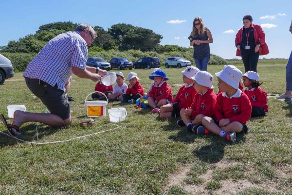 showing kids how to sieve microplastics
